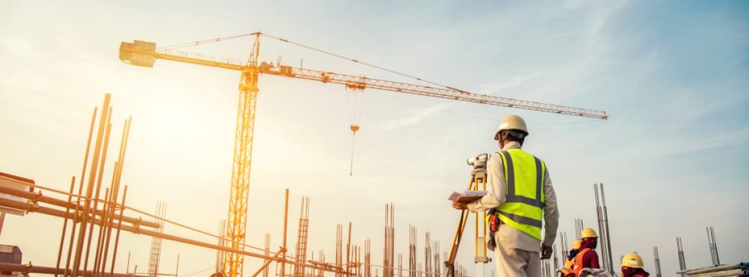 Surveyor,Builder,Engineer,With,Theodolite,Transit,Equipment,At,Construction,Site